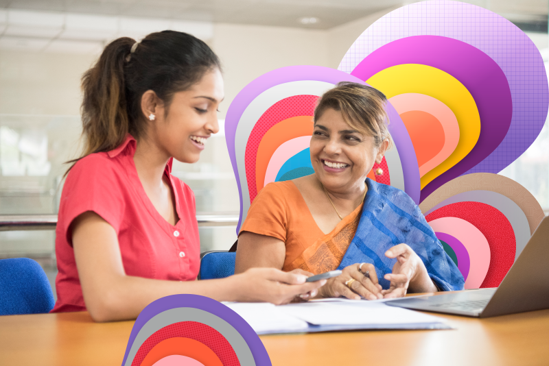 photo of two employees working together